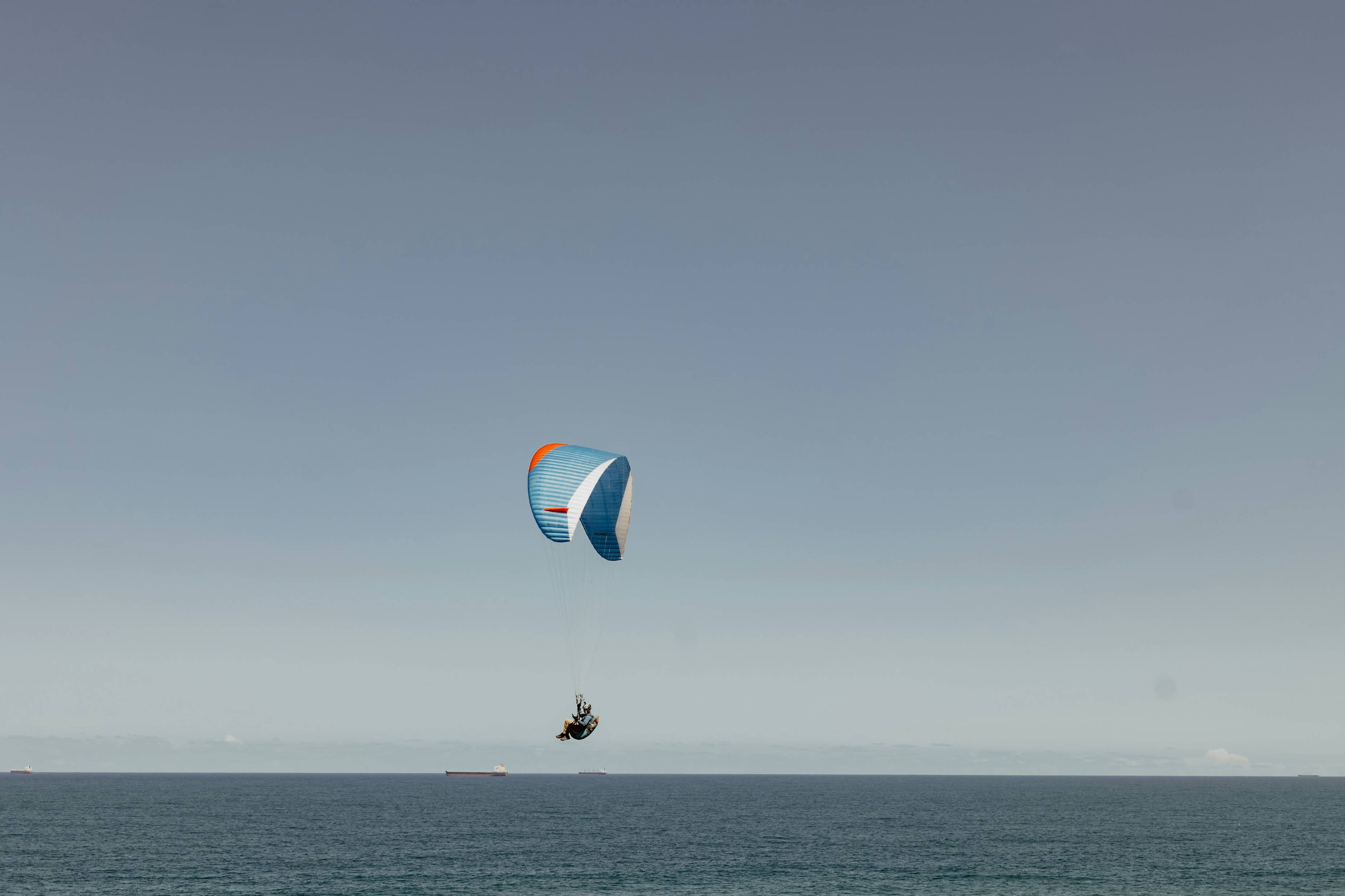 a person parasailing on the water